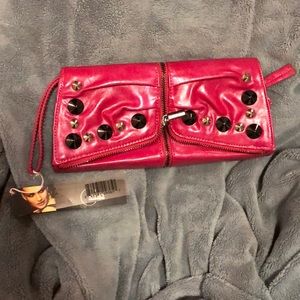 New with Tag. Pink clutch. Purchase today!